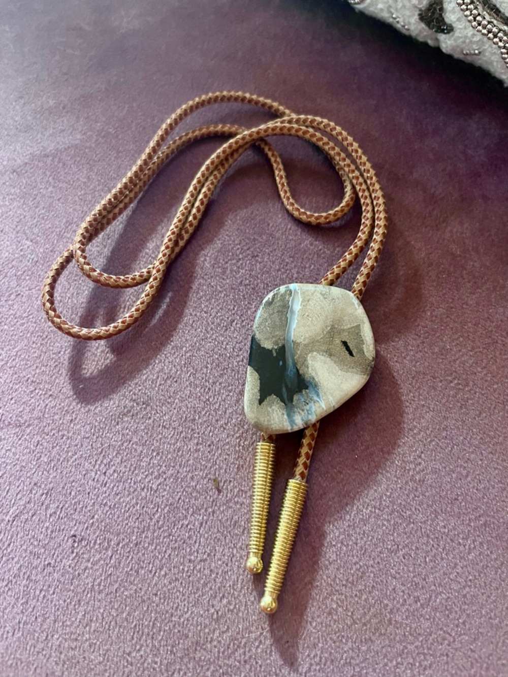 Source Unknown Brown and Black Stone Bolo Tie with Gold Tips